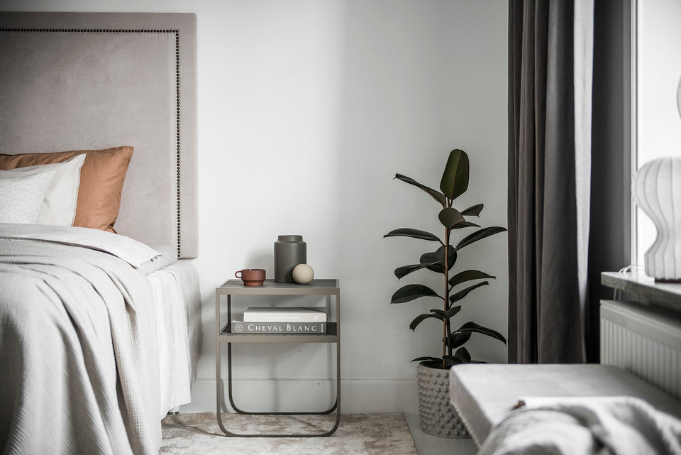 Designed by Broberg and Ridderstråle 2012. Bedside table with a bent metal structure and solid stone or stained oak top. Choose from multiple color and material options.