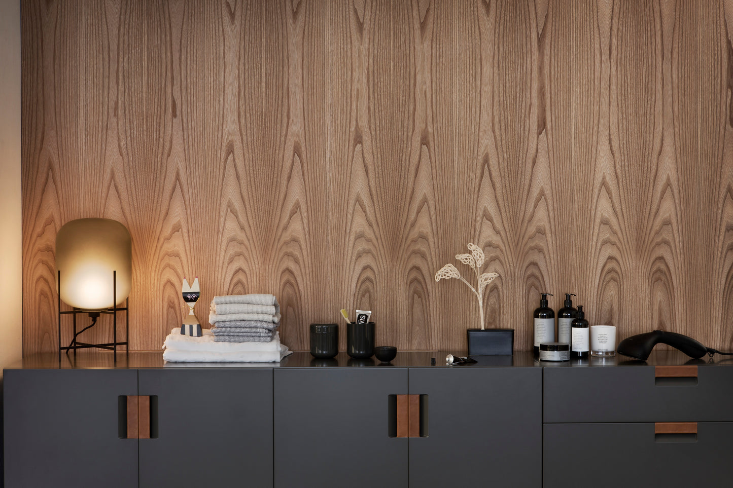 Designed by Anya Sebton and Eva Lilja Löwenhielm 2014. Storage unit with 2 folding doors and handles in leather with 2 compartments and 2 lacquered shelves.