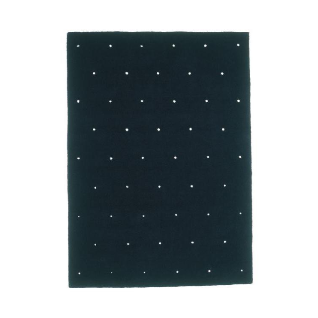 Designed by Thomas Sandell 2000.  Hand tufted rug with a perforated pattern.
