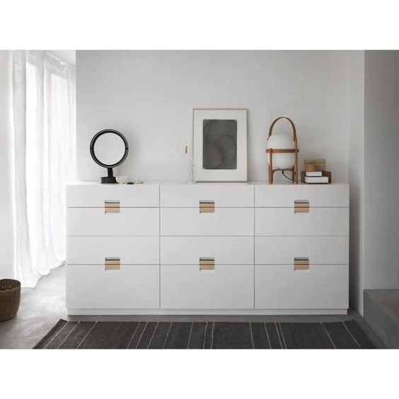 Designed by Anya Sebton and Eva Lilja Löwenhielm 2014.  Storage unit with 4 drawers and handles in leather. 1 medium, 2 large and 1 XL drawer.  