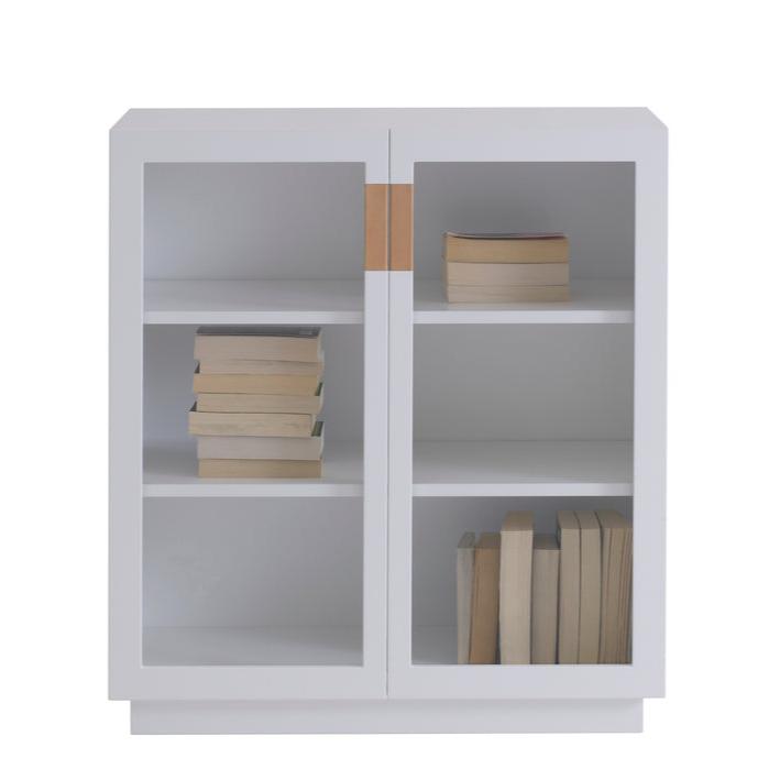 Designed by Anya Sebton and Eva Lilja Löwenhielm 2014.  Storage unit with 1 sliding door in glass. Including two lacquered adjustable shelves. Cabinet with glass doors has no holes at the back.