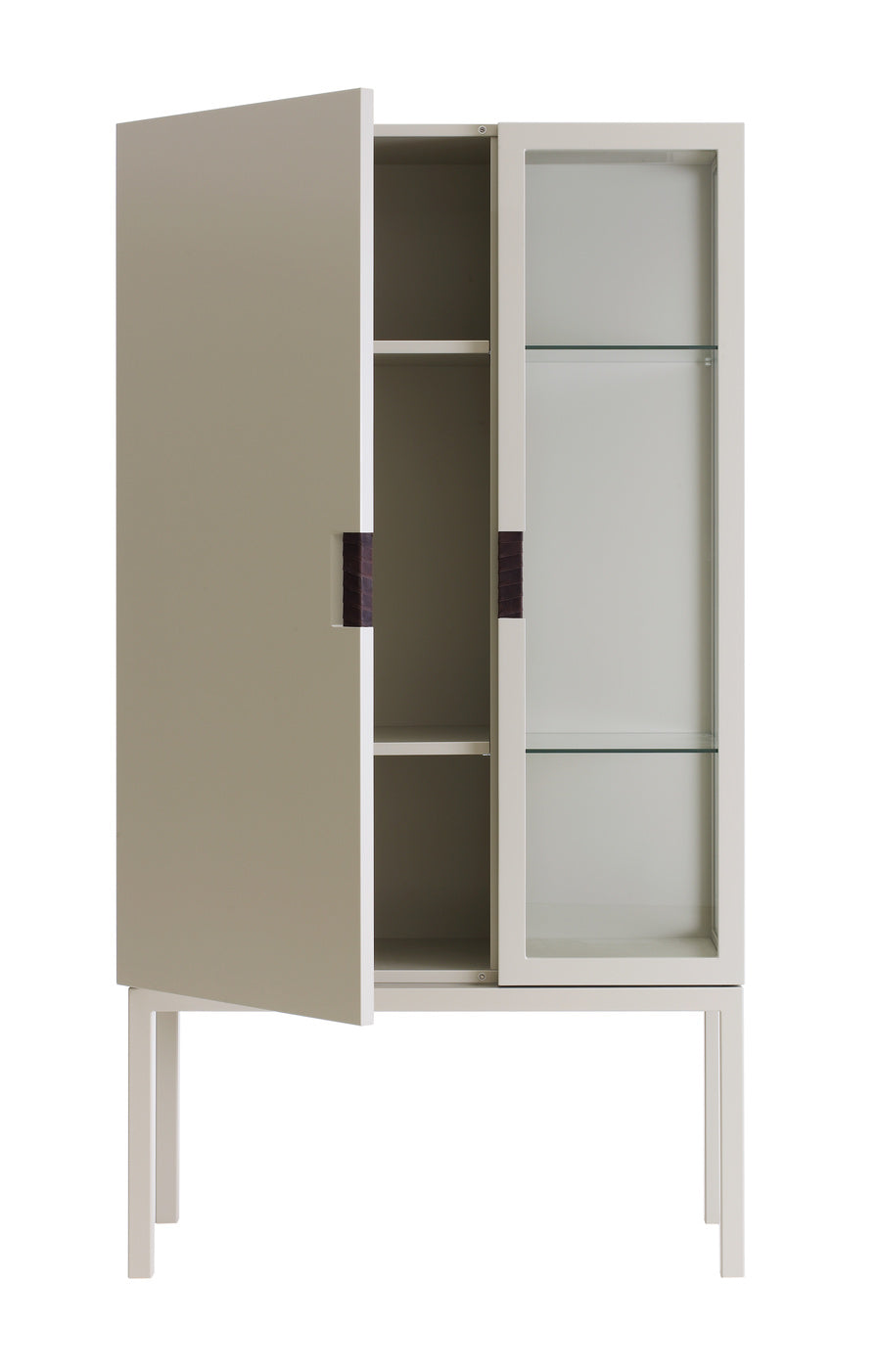 Designed by Anya Sebton and Eva Lilja Löwenhielm 2014. Glass cabinet in lacquered MDF, stand in lacquered metal. The left side has a covered door and a covered side with two lacquered shelves and the right side has a glass door and a glass side with two glass shelves. Doors have twined leather handles.