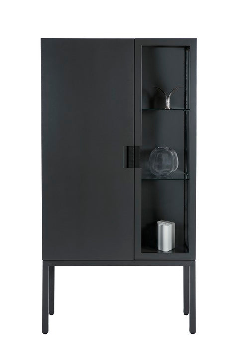 Designed by Anya Sebton and Eva Lilja Löwenhielm 2014.  Glass cabinet in lacquered MDF, stand in lacquered metal. The left side has a covered door and a covered side with two lacquered shelves and the right side has a glass door and a glass side with two glass shelves. Doors have twined leather handles.