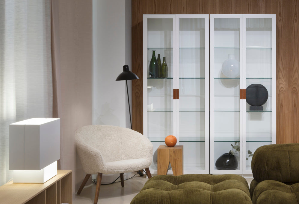 Designed by Anya Sebton and Eva Lilja Löwenhielm 2014. The highest cabinet in the Frame series, with glass doors and handles in leather. Two glass doors and standard hinges. Four adjustable glass shelves.