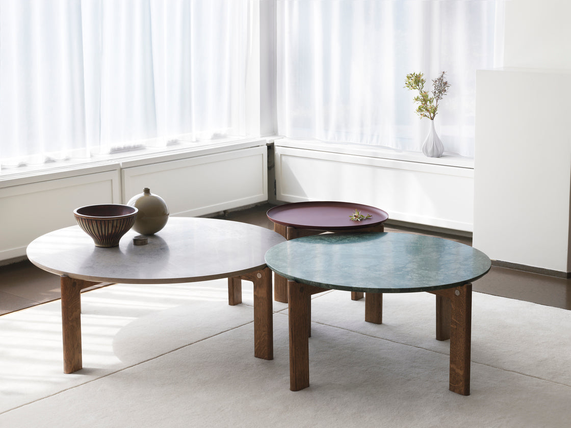 Designed by Daniel Lavonius Jarefeldt 2023.  Iris round coffee table with a monochrome top with a distinctive raised edge. This comes in four colors that can be nicely combined in a setting with stone tops. Available in all three sizes.