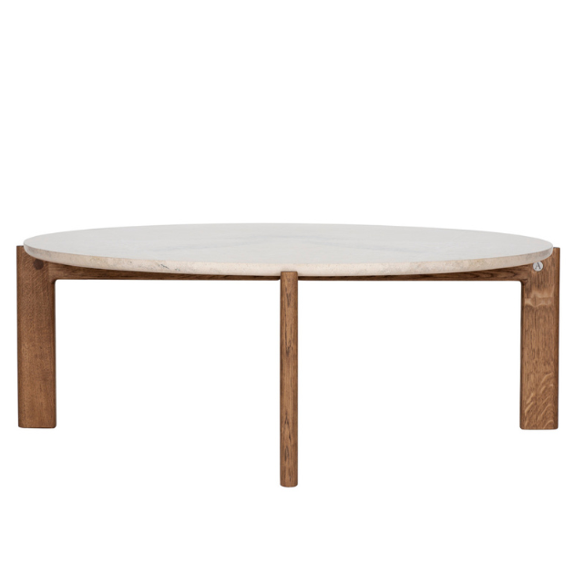 Designed by Daniel Lavonius Jarefeldt 2023.  Iris is a round coffee table with a simple, clean, and functional shape and descriptive details. The base has softly rounded corners where part of the legs embraces the tabletop.