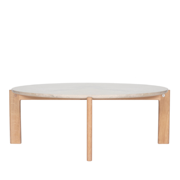 Designed by Daniel Lavonius Jarefeldt 2023.  Iris is a round coffee table with a simple, clean, and functional shape and descriptive details. The base has softly rounded corners where part of the legs embraces the tabletop.