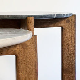 Designed by Daniel Lavonius Jarefeldt 2023.  Iris is a round coffee table with a simple, clean, and functional shape and descriptive details. The base has softly rounded corners where part of the legs embraces the tabletop.