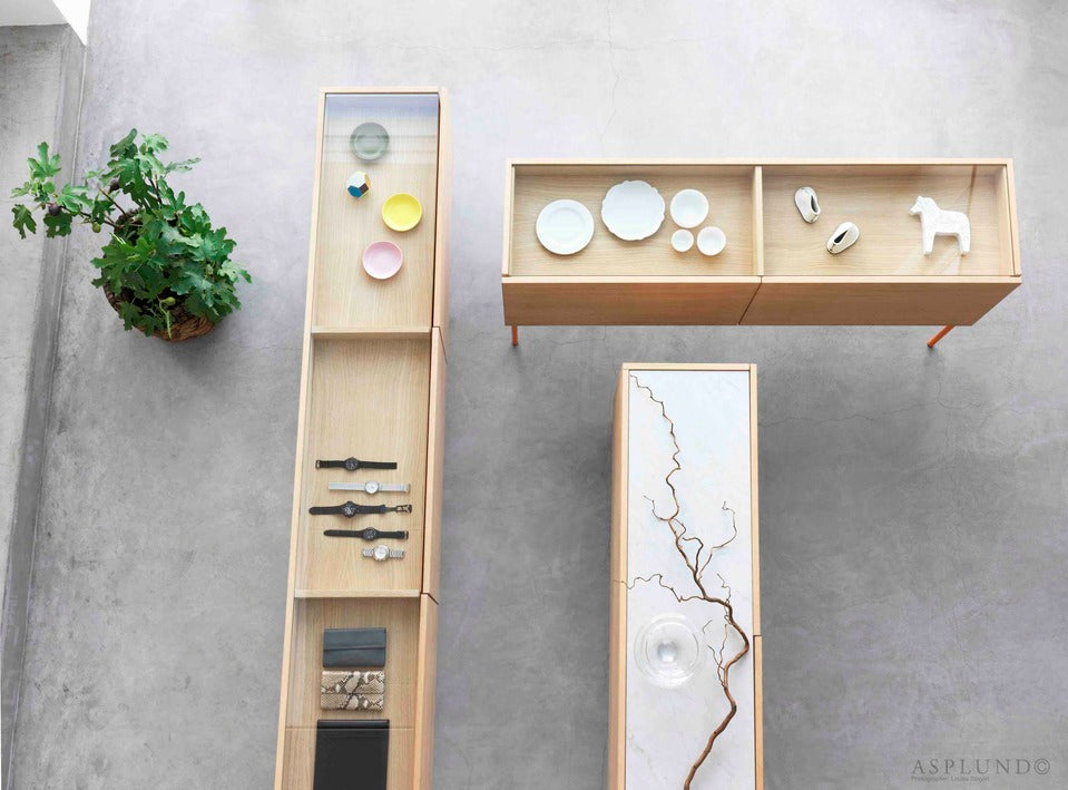 Designed by Broberg and Ridderstråle 2012.  Storage unit with 2 drawers and a stand in lacquered metal and stone or glass top.