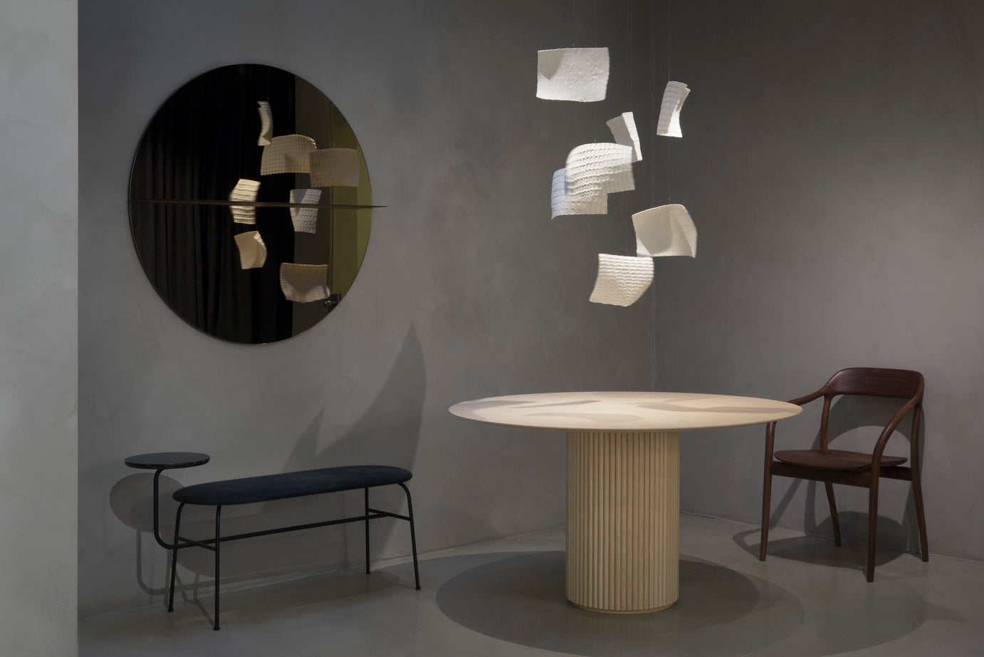 Designed by Anya Sebton and Eva Lilja Löwenhielm 2016. Round mirror with a horizontal metal shelf. Metal wall fixture included. Screws for attachment against the wall are not included.