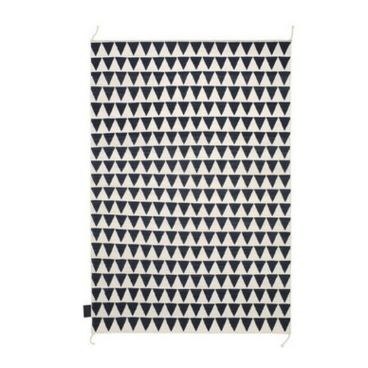 Designed by Thomas Sandell 2010.  Hand woven Kelim rug with pattern in contrasting colors. The kelim yarn is selected to be extra soft and lustrous. 