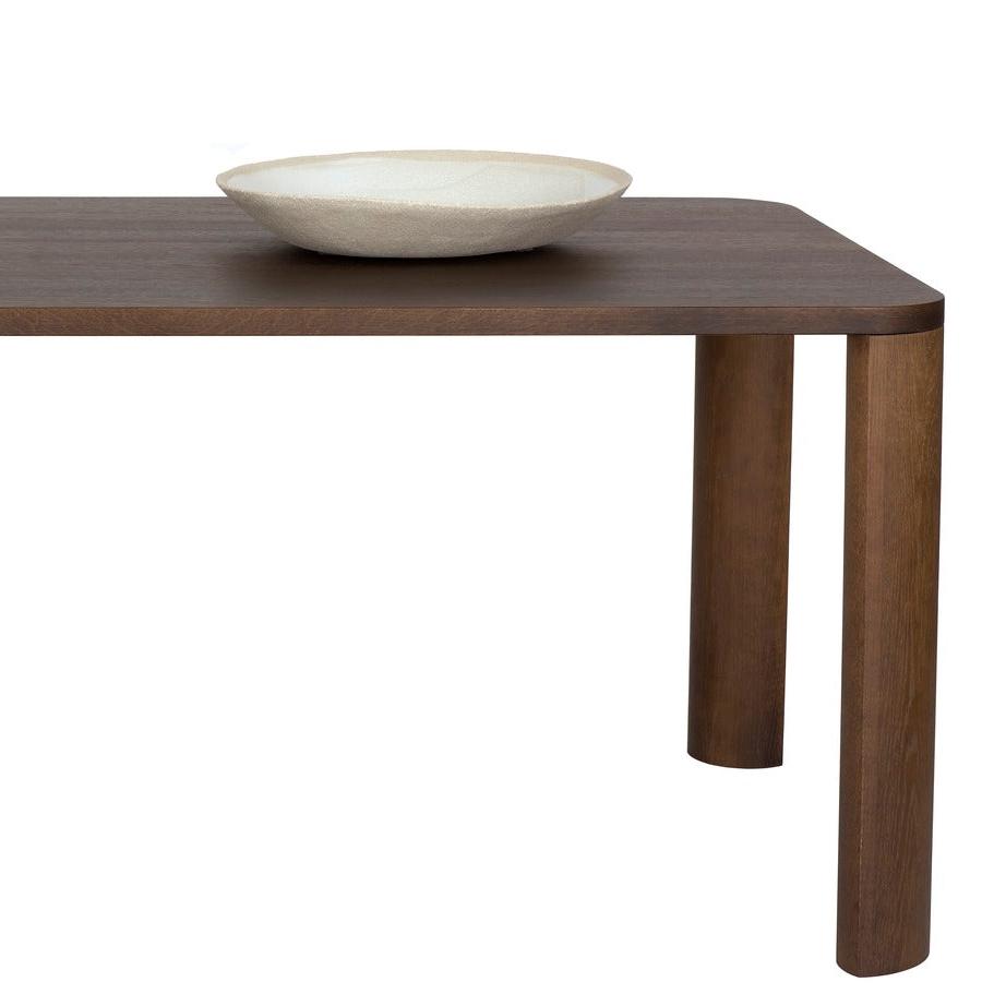 Designed by Moa Sjöberg 2021/22. Moci is a handcrafted and generous table for dining or conference purposes with massive oak legs and an oak veneer top. Available in two sizes and three colors. Made in Sweden.