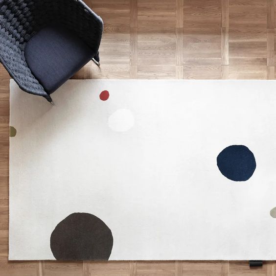 Designed by Thomas Sandell 2008.  Hand tufted rug with set base colors and pattern in contrasting colors.