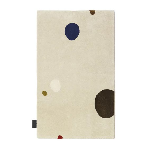 Designed by Thomas Sandell 2008.  Hand tufted rug with set base colors and pattern in contrasting colors.