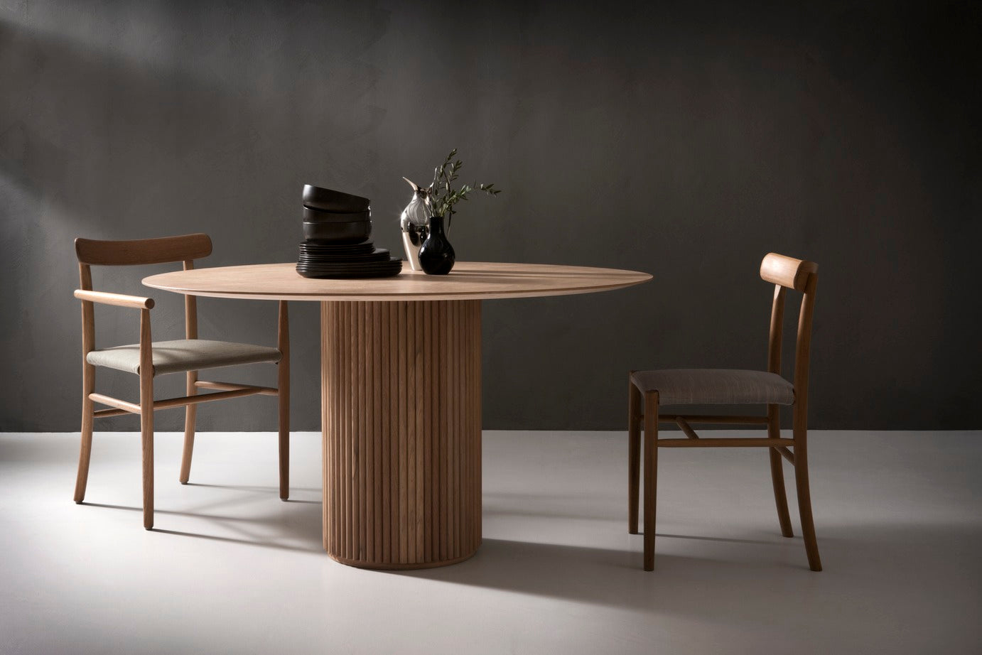 Designed by Anya Sebton and Eva Lilja Löwenhielm 2018.  Round table with base in solid oak or ash panels. Top in veneer with a solid oak edge in the same color as the base. Available in multiple color options.