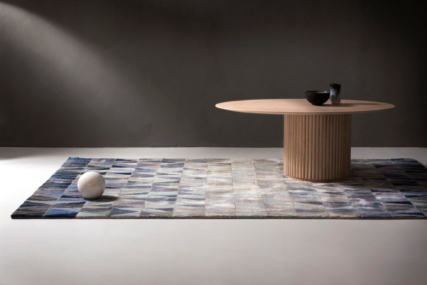 Designed by Anya Sebton and Eva Lilja Löwenhielm 2018.  Oval coffee table with base in solid oak or ash panels. Top in veneer with a solid oak edge in the same color as the base. Available in multiple color options.