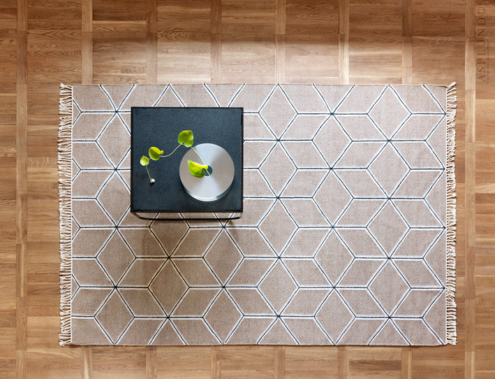 Designed by Emma Olbers 2014.  Hand-woven dhurrie rug. The wool used in this rug has natural colors and gives the fabric a melange look. Set base and pattern colors.