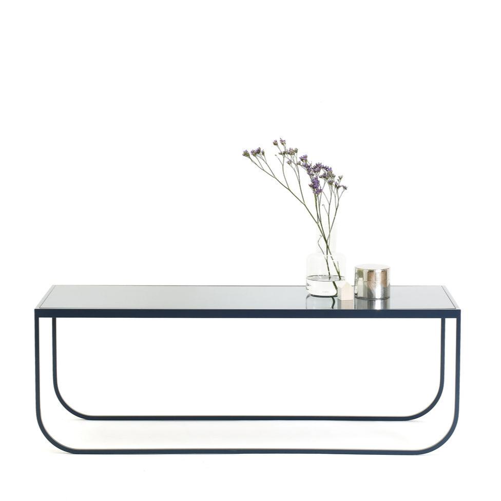Designed by Broberg and Ridderstråle 2011.  Lounge table with a bent metal structure. Tati Lounge 120 can be slid under Tati Lounge 65.