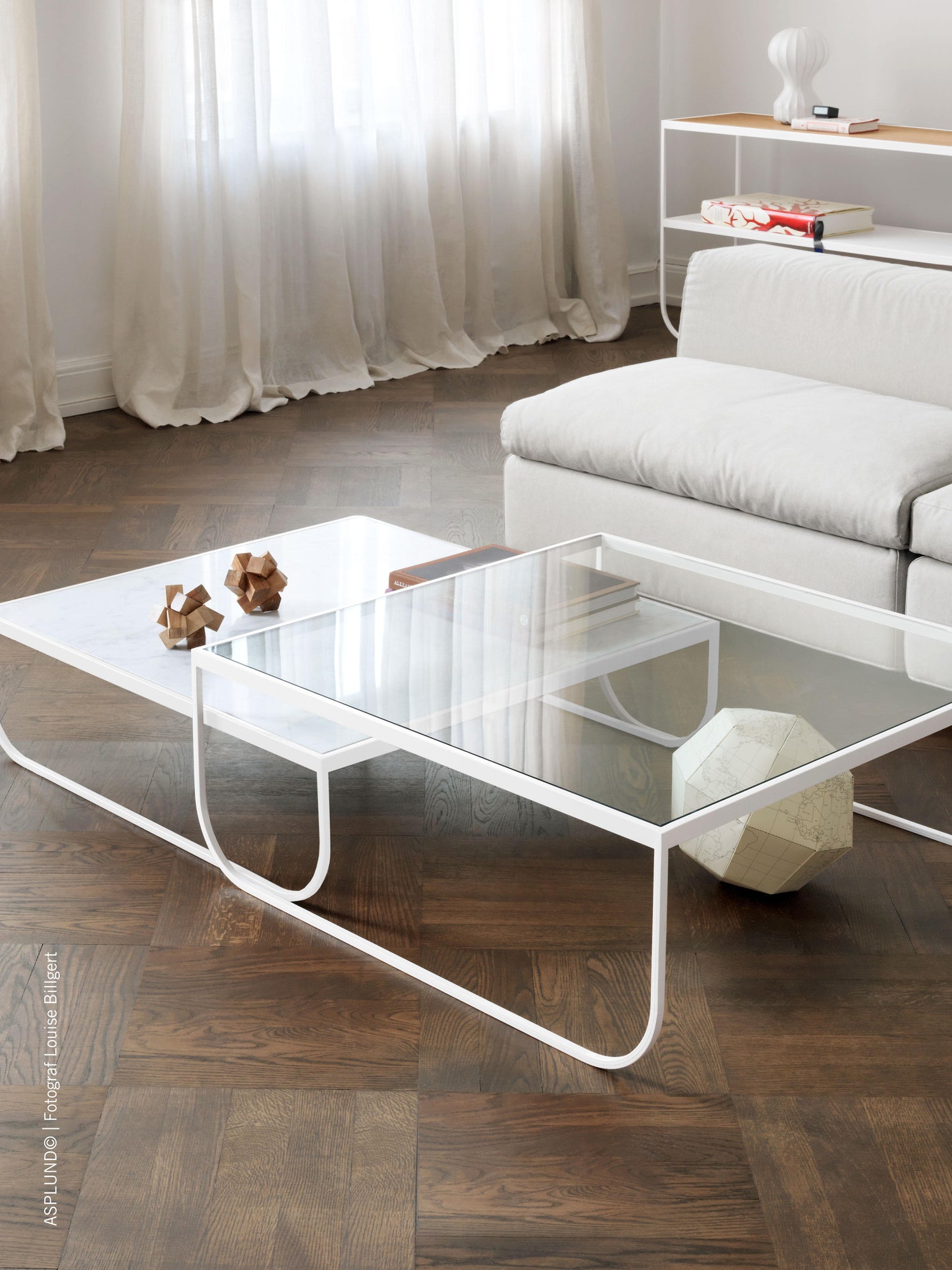 Designed by Broberg and Ridderstråle 2011. Coffee table with a bent metal structure. Tati Coffee Table 90 High can be slid over Tati Coffee Table 90 Low.
