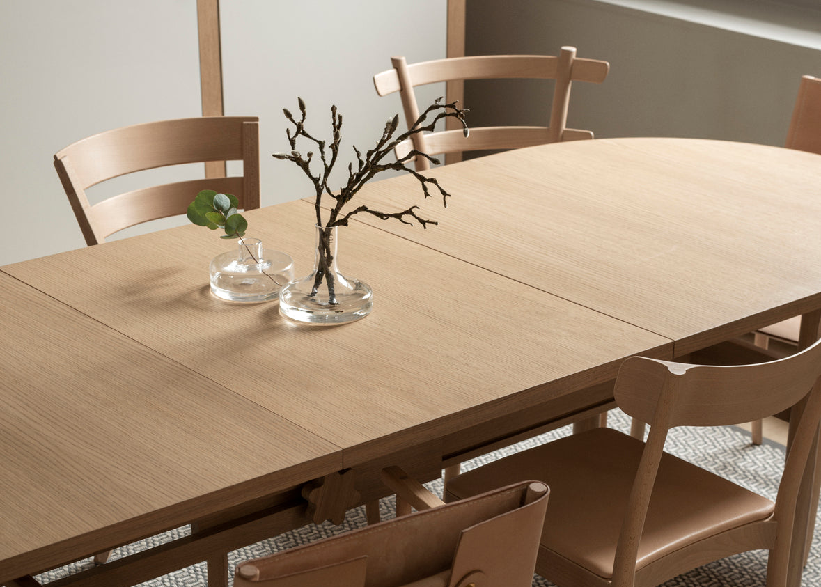 Designed by Anya Sebton and Eva Lilja Löwenhielm 2018.  Round table with base in solid oak or ash panels. Top in veneer with a solid oak edge in the same color as the base. Available in multiple color options. 