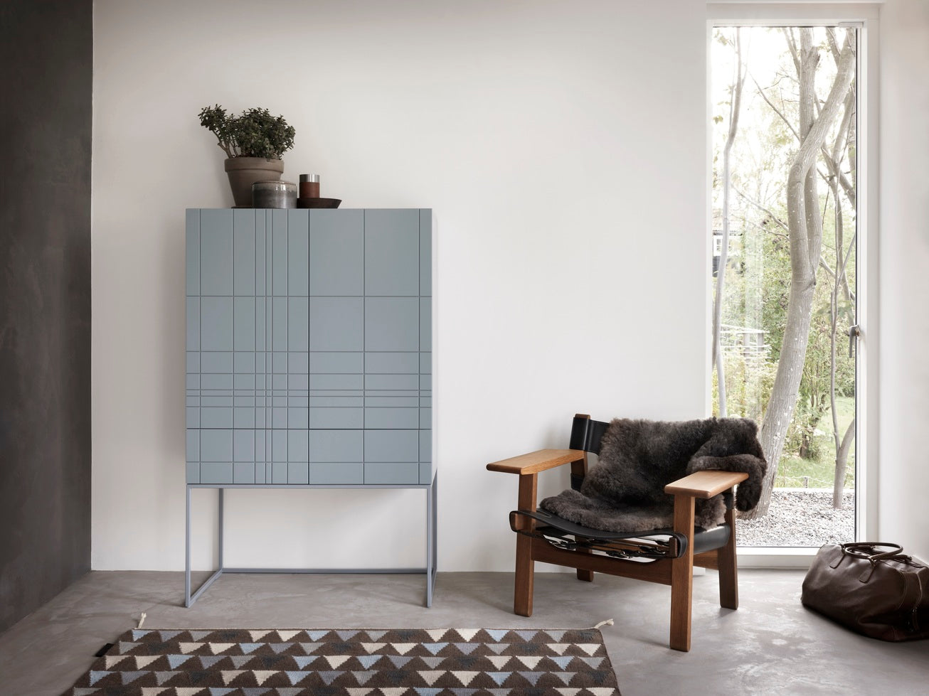 Designed by Claesson Koivisto Rune 2011.  Cabinet in lacquered MDF with lacquered metal stand in the same color. The cabinet has two doors and two drawers—inside a drawer in birch.