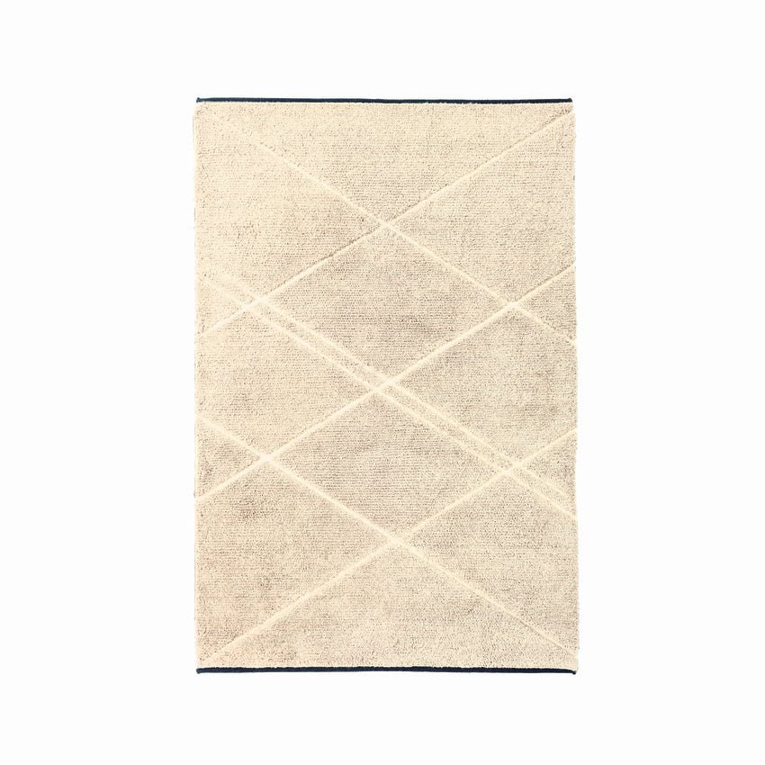 Designed by Anya Sebton &amp; Eva Lilja Löwenhielm 2013.  The wool used in this carpet is natural wool giving the weave a melange look with lines in Natural White (61). The edges have a contrasting color for that special touch.&nbsp;