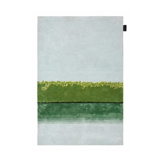 A hand-tufted rug with a Nordic winter afternoon landscape with hand-cut details and mixed compositions of yarn in a fixed blend. It is made of a special wool and Tencel blend. Horizon is designed to be hung on the wall or lay on the floor.