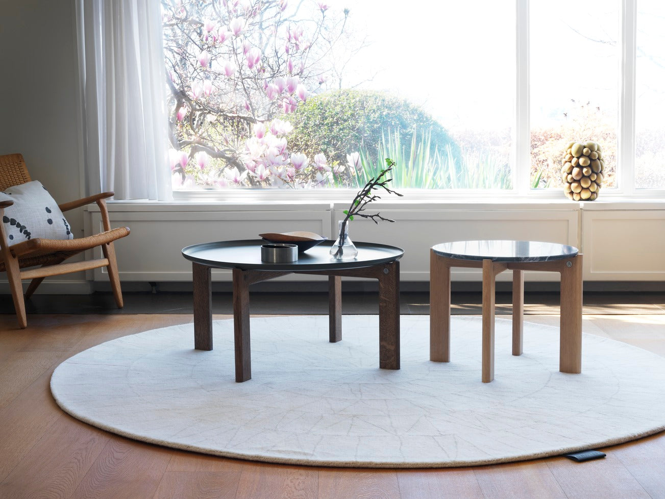 Designed by Daniel Lavonius Jarefeldt 2023.  Iris is a round coffee table with a simple, clean, and functional shape and descriptive details. The base has softly rounded corners where part of the legs embraces the tabletop. 