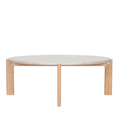 Designed by Daniel Lavonius Jarefeldt 2023.  Iris is a round coffee table with a simple, clean, and functional shape and descriptive details. The base has softly rounded corners where part of the legs embraces the tabletop. 