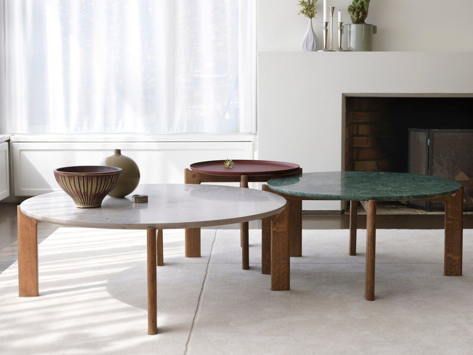 Designed by Daniel Lavonius Jarefeldt 2023.  Iris round coffee table with a monochrome top with&nbsp;a distinctive raised edge. This comes in four colors that can be nicely combined in a setting with stone tops. Available in all three sizes.