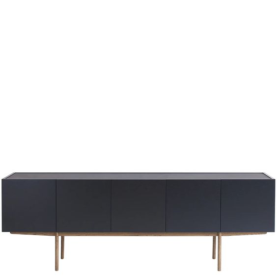 Designed by Broberg and Ridderstråle.  Storage in lacquered oak veneer with a wooden base and stone top. Cabinet with two compartments and four doors. One shelf in each compartment.