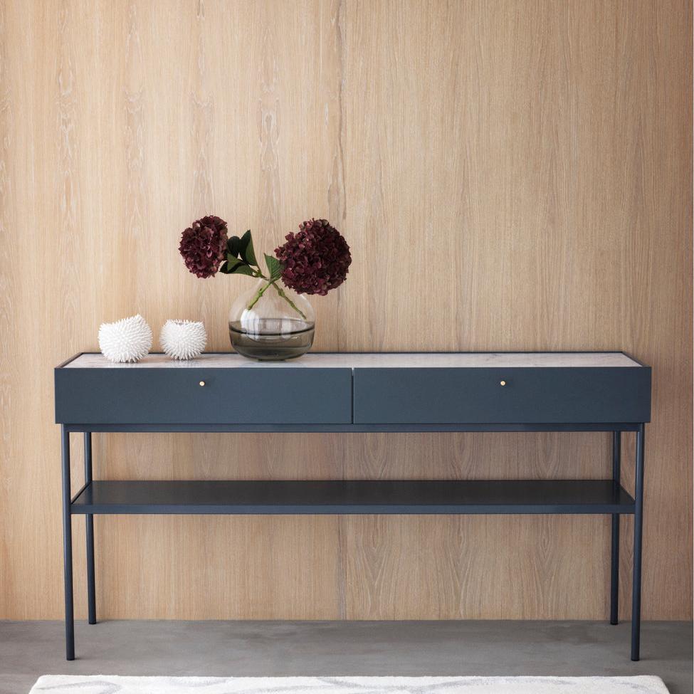 Designed by Broberg and Ridderstråle 2015.  Console in lacquered MDF with 2 drawers with brass knobs and a lacquered MDF shelf. Stand in lacquered metal and top in stone or oak veneer. 