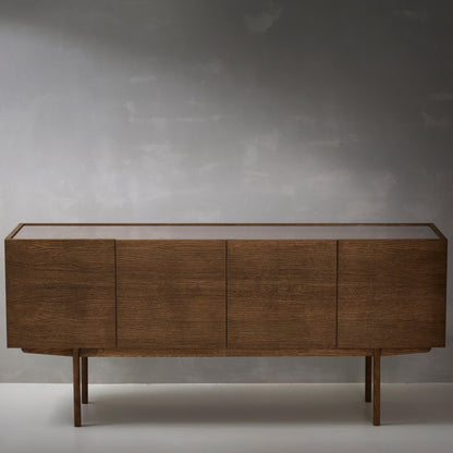 Designed by Broberg and Ridderstråle.  Storage in oak veneer with a wooden base and glass on wood top. Cabinet with two compartments and four doors. One shelf in each compartment.