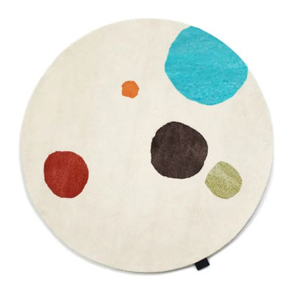 Designed by Thomas Sandell 2008.  Hand tufted rug in white with a pattern in contrasting colors.