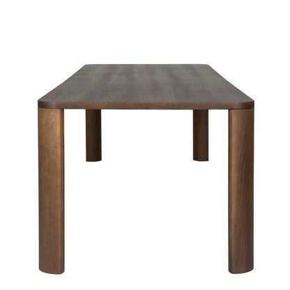 Designed by Moa Sjöberg 2021/22.  Moci is a handcrafted and generous table for dining or conference purposes with massive oak legs and an oak veneer top. Available in two sizes and three colors. Made in Sweden.