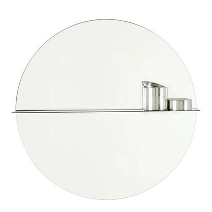 Designed by Anya Sebton and Eva Lilja Löwenhielm 2016.  Round mirror with a horizontal metal shelf. Metal wall fixture included. Screws for attachment against the wall are not included.