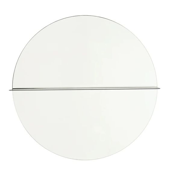 Designed by Anya Sebton and Eva Lilja Löwenhielm 2016.  Round mirror with a horizontal metal shelf. Metal wall fixture included. Screws for attachment against the wall are not included.