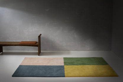 Handloom carpet featuring a timeless rugby shirt pattern in soft, colorful, or neutral tones.