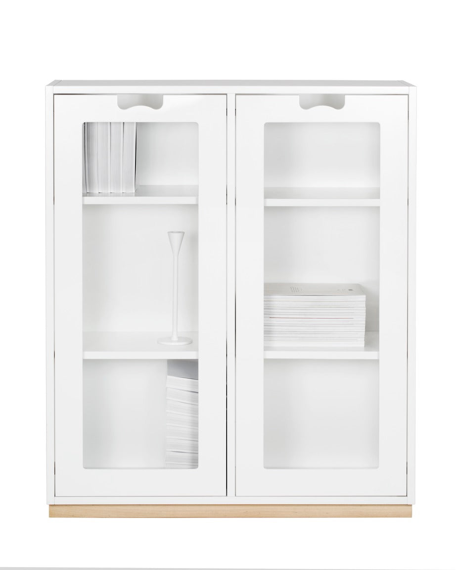 Designed by Thomas Sandell and Jonas Bohlin 1994.   The classic Snow Cabinet E has 2 soft-closing glass doors, a middle partition, and four shelves. Extra shelves can be ordered.  Choose between two depths.