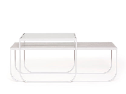Designed by Broberg and Ridderstråle 2011.  Lounge table with a bent metal structure. Tati Lounge 65 can be slid over Tati Lounge 120.